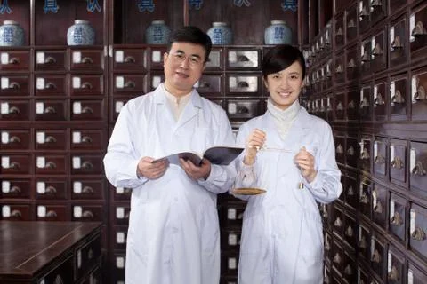 Weighing tools a man 40 to 60. Young woman Education Drawer Horizontal frame Stock Photos