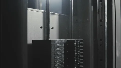 Weight falling in block machine and cloud of powder raising in dark gym in slomo Stock Footage 104521801