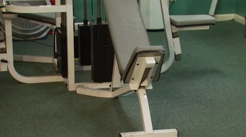 Weight lifting machine in gym Stock Footage 54592903