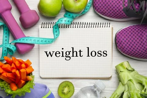 Weight loss concept. Flat lay composition with notebook, sneakers and diffe.. Foto stock