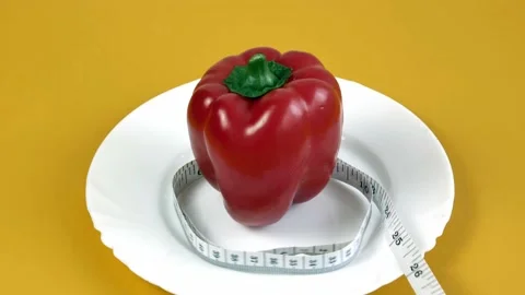 Weight loss concept red pepper with measuring tape. Stock Footage 168748331