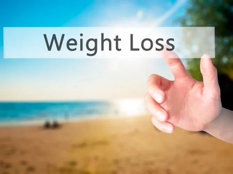 Weight Loss - Hand pressing a button on blurred background concept on visual  Stock Photos