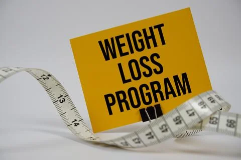 Weight Loss Program text with alarm clock on white background Foto stock