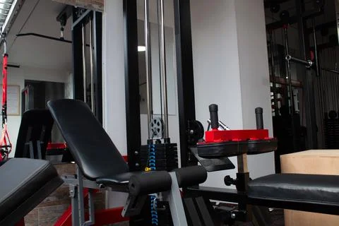 Weight machine in a gym to do arm training with weight Stock Photos