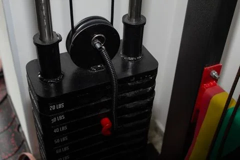 Weight machine in a gym for exercise Stock Photos