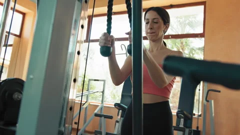 Weight Moving On The Machine While A Woman Trains Stock Footage 282009963