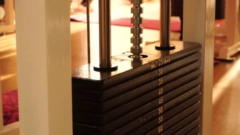Weight stack from a cable exercise machine Stock Footage 82226789