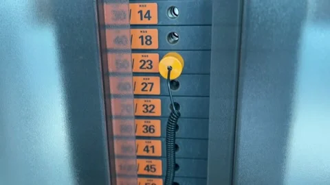 A weight stack on a gym machine, showing a series of rectangular weight 動画素材 282697479