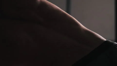 Weight training exercise with a ball above head in a gym setting Stock Footage 312763186