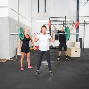 Weight training with personal trainer Stock Photos