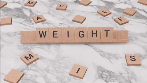 WEIGHT word written on scrabble Stock Footage 256958022