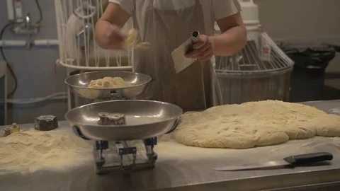 Weighting bread dough in the kitchen  Stock Footage 71540123