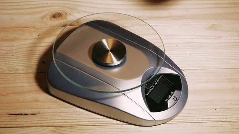 Weighting marijuana on a scale Stock Footage 79955027