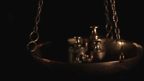 Weighting process on an antique bronze scale plate Stock Footage 148122787
