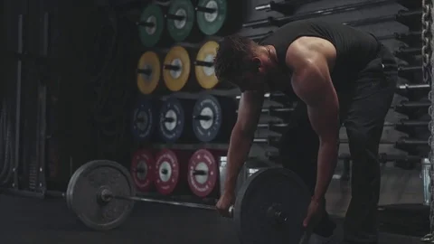 Weightlifter finishing exercise Stock Footage 76725239