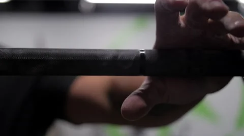 Weightlifter grabs on to barbell Stock Footage 41265861