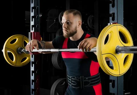 The weightlifter is near the bar Stock Photos
