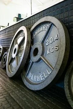 Weights on the gym floor Stock Photos