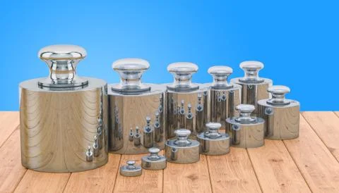 Weights Scale Calibration Set on the wooden table, 3D rendering Stock Illustration