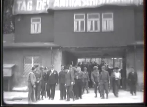 WEIMAR - 1945: Concentration Camp Visit — Group leaves the gatehouse Видео 342819472