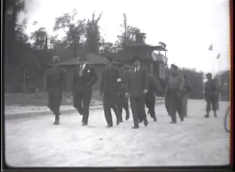 WEIMAR - 1945: Concentration Camp Visit — Roadway under a painted banner Видео 342819492
