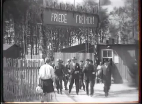 WEIMAR - 1945: Concentration Camp Visit — Striped jacket at the gate Stock Footage 342819506