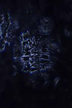 Weird abstract backlit ice patterns on frozen glass with bizarre lines, curve Stock Photos