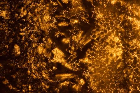 Weird abstract backlit ice patterns on frozen glass with bizarre lines, curve Stock Photos