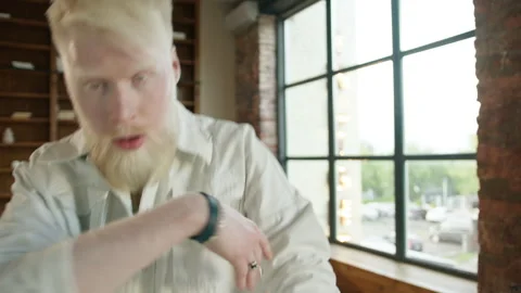 Weird albino guy lost touch with outside world, withdraw himself techno music 4K Stock Footage 255110617