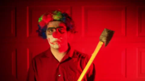 Weird clown ax axe creepy Stock Footage