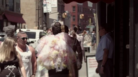 Weird, disguised people walking down the sidewalk in Brooklyn, New York. Stock Footage 75324932