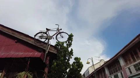 Weird old bicycle on top of building. Stock Footage 170469877
