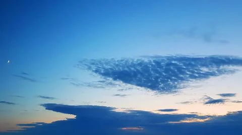 Weirdly Shaped Cloud and the Moon Stock Photos
