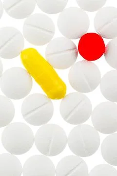 Weiße und bunte Tabletten, Symbolfoto für Medizin, Heilmittel und Tablette. Stock Photos
