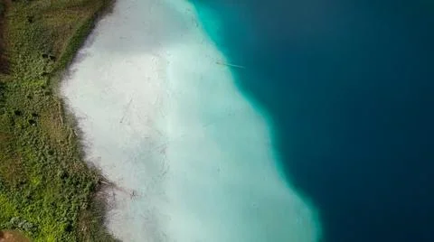 Weissensee - A top down drone shot of a turquoise Alpine lake Stock Photos
