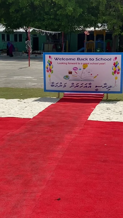 Welcome back to school red carpet entrance on local Maldives island Stock Footage 344602875