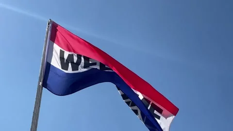 Welcome flag blowing in wind with red, white and blue colours Stock Footage 153843204