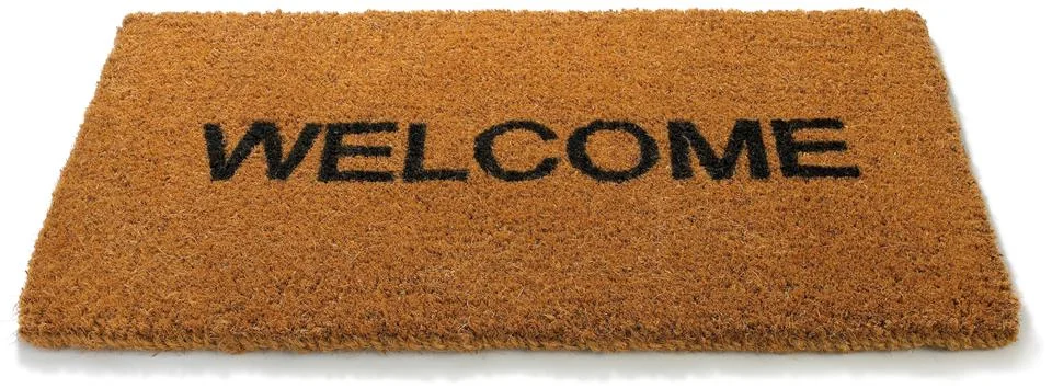 Welcome front door mat isolated on a white background Stock Photos