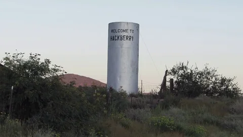 Welcome to Hackberry AZ Water Storage Tank Sign off of US Route 66 Highway Stock Footage 80106079