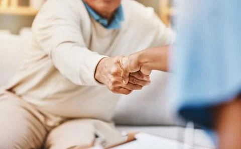 Welcome handshake, healthcare caregiver and senior medical insurance support Stock Photos