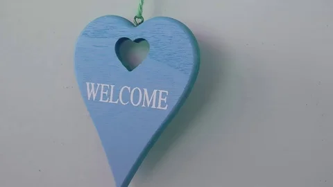 Welcome Heart Shaped Pendulum Moving With The Wind In Slow Motion 스톡 동영상 118190406