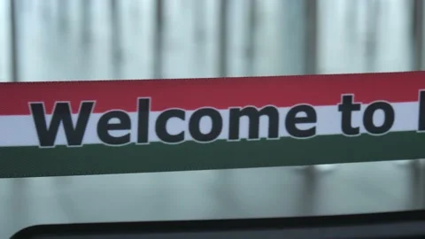 "Welcome To Hungary Stripes" At Airport Arrival Hall Stock Footage 130275953