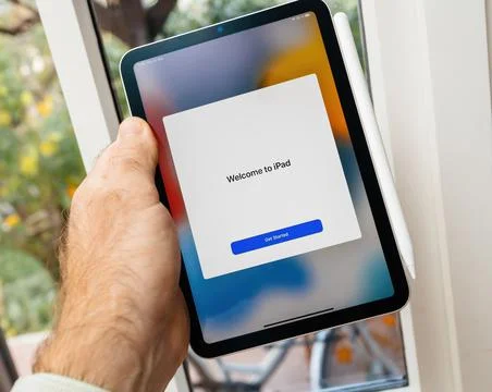 Welcome to iPad, get started button message on the new sixth-generation Apple Stock Photos