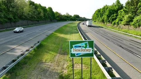 Welcome to New Jersey. Aerial pullback reveal shot on sunny morning. Stock Footage 241884927
