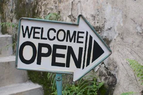 Welcome / Open arrow sign Stock Photos