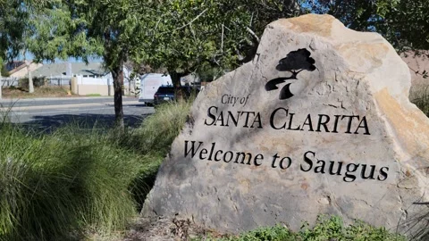 Welcome to Saugus sign with traffic Stock Footage 231165249