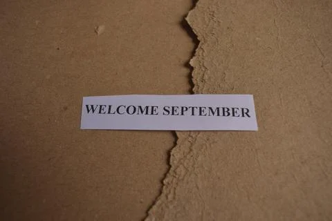 Welcome September message on rustic handmade paper with earthy textured bac.. Stock Photos