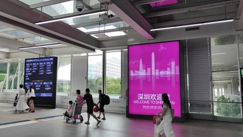 Welcome to Shenzhen: City Image Posters and Travelers at Shenzhen Airport Stock-Footage 342687328