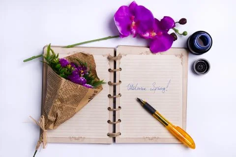 Welcome Spring - A Notebook With Two Bunches Of Flowers Stock Photos