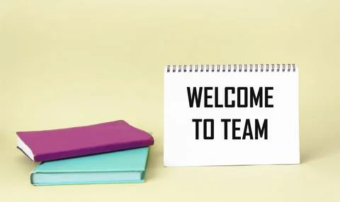WELCOME TO THE TEAM text concept written on a notepad with diaries on a light Stock Photos